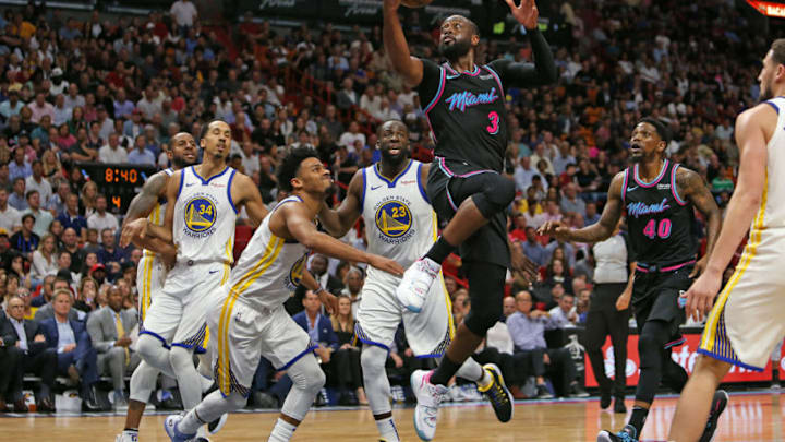 Miami Heat guard Dwyane Wade (3) goes to the basket against Golden State Warriors Andre Iguodala (9), Shaun Livingston (34), Quinn Cook (4), Draymond Green (23) and Klay Thompson (11) in the fourth quarter at AmericanAirlines Arena in Miami on Wednesday, Feb. 27, 2019. The Heat won, 126-125. (David Santiago/Miami Herald/TNS via Getty Images)