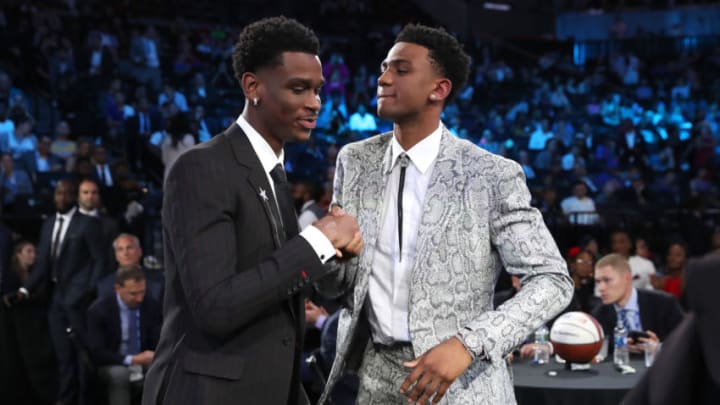 Shai Gilgeous-Alexander, Nickeil Alexander-Walker after being selected seventeenth overall by the Brooklyn Nets (Photo by Michael J. LeBrecht II/NBAE via Getty Images)