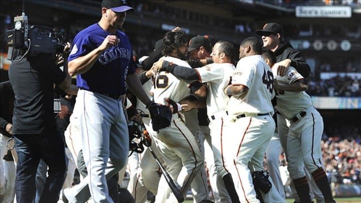May 25, 2013; San Francisco, CA, USA; San Francisco Giants center fielder Angel Pagan (16) in middle, celebrates with Giants team after hitting an inside-the-park homerun in the bottom of the tenth inning against the Colorado Rockies at AT