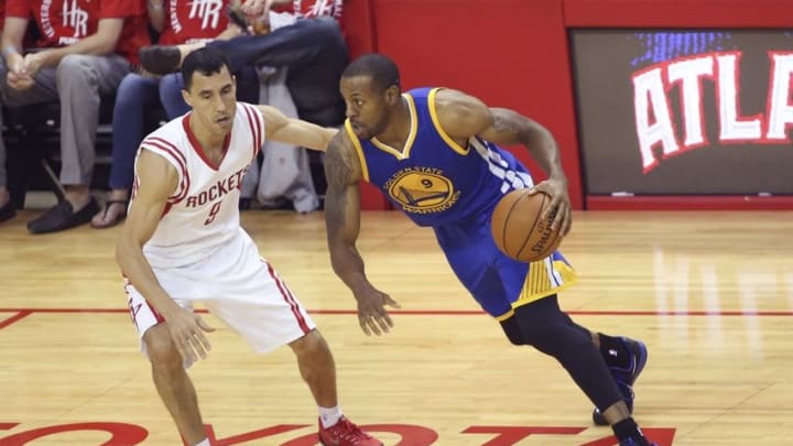 May 25, 2015; Houston, TX, USA; Golden State Warriors guard Andre Iguodala (9) drives to the basket as Houston Rockets guard Pablo Prigioni (9) defends during the second half in game four of the Western Conference Finals of the NBA Playoffs. at Toyota Center. Mandatory Credit: Troy Taormina-USA TODAY Sports