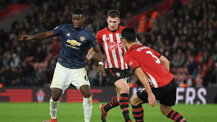 SOUTHAMPTON, ENGLAND - DECEMBER 01: Paul Pogba of Manchester United is challenged by Pierre-Emile Hojbjerg and Maya Yoshida of Southampton during the Premier League match between Southampton FC and Manchester United at St Mary's Stadium on December 01, 2018 in Southampton, United Kingdom. (Photo by Mike Hewitt/Getty Images)