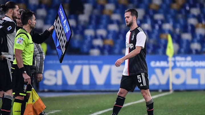 Juventus' Bosnian midfielder Miralem Pjanic (R) leaves the pitch to be substituted by Juventus' French midfielder Adrien Rabiot (L) after being injured during the Italian Serie A football match Napoli vs Juventus on January 26, 2020 at the San Paolo stadium in Naples. (Photo by Alberto PIZZOLI / AFP) (Photo by ALBERTO PIZZOLI/AFP via Getty Images)