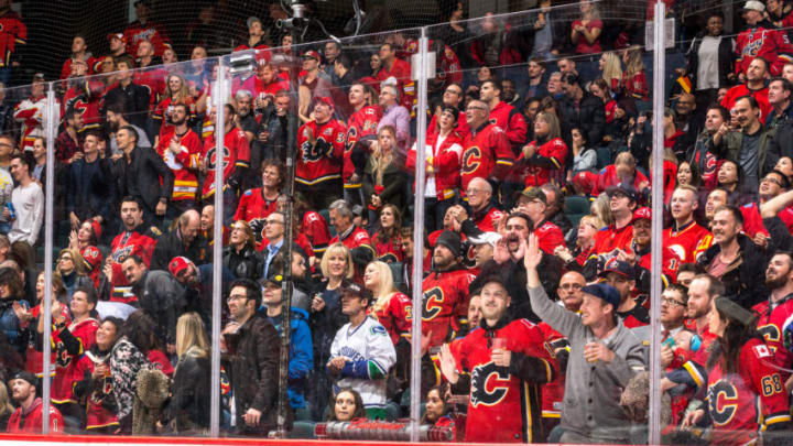 CALGARY, AB - DECEMBER 09: Fans of the Calgary Flames cheer after a win in a NHL game against the Vancouver Canucks at the Scotiabank Saddledome on December 09, 2017 in Calgary, Alberta, Canada. (Photo by Gerry Thomas/NHLI via Getty Images)