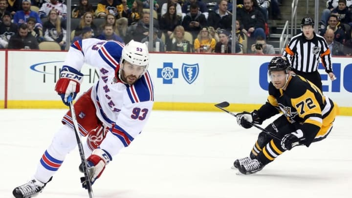 Mar 3, 2016; Pittsburgh, PA, USA; New York Rangers defenseman Keith Yandle (93) gathers the puck ahead of Pittsburgh Penguins right wing Patric Hornqvist (72) during the second period at the CONSOL Energy Center. The Penguins won 4-1. Mandatory Credit: Charles LeClaire-USA TODAY Sports