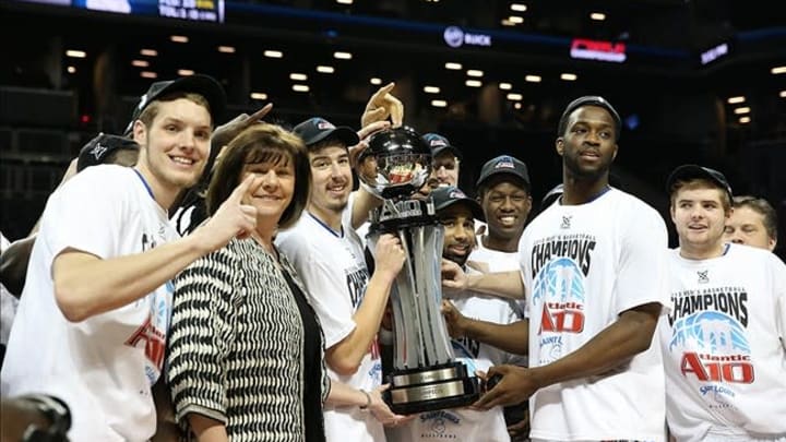 Mar 17, 2013; Brooklyn, NY, USA; A10 commissioner Bernadette McGlade presents the trophy to the Saint Louis Billikens for the championship game of the Atlantic 10 at the Barclays Center. Saint Louis won 62-56. Mandatory Credit: Anthony Gruppuso-USA TODAY Sports