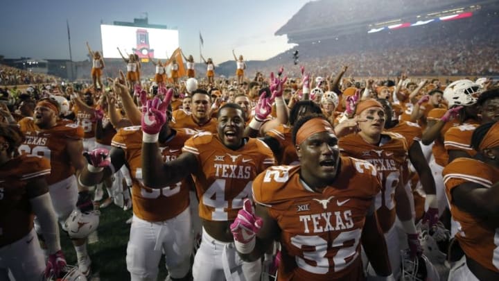 Oct 29, 2016; Austin, TX, USA; Texas Longhorns players Brando Hodges (58), Quincy Vasser (44), and Malcolm Roach (32) celebrate after defeating the Baylor Bears 35-34 at Darrell K Royal-Texas Memorial Stadium. Mandatory Credit: Erich Schlegel-USA TODAY Sports
