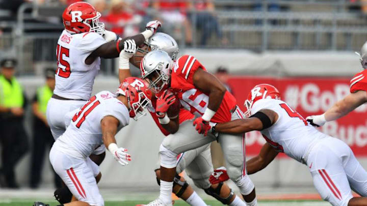 COLUMBUS, OH - OCTOBER 1: Antonio Williams #26 of the Ohio State Buckeyes is brought down by Anthony Cioffi #31 of the Rutgers Scarlet Knights and Kevin Marquez #40 of the Rutgers Scarlet Knights after a gain in the fourth quarter at Ohio Stadium on October 1, 2016 in Columbus, Ohio. Ohio State defeated Rutgers 58-0. (Photo by Jamie Sabau/Getty Images)