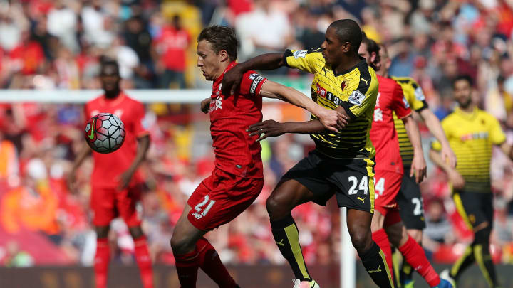 LIVERPOOL, ENGLAND – MAY 08: Lucas Leiva of Liverpool holds off Odion Ighalo of Watford during the Barclays Premier League match between Liverpool and Watford at Anfield on May 8, 2016 in Liverpool, England. (Photo by Jan Kruger/Getty Images)