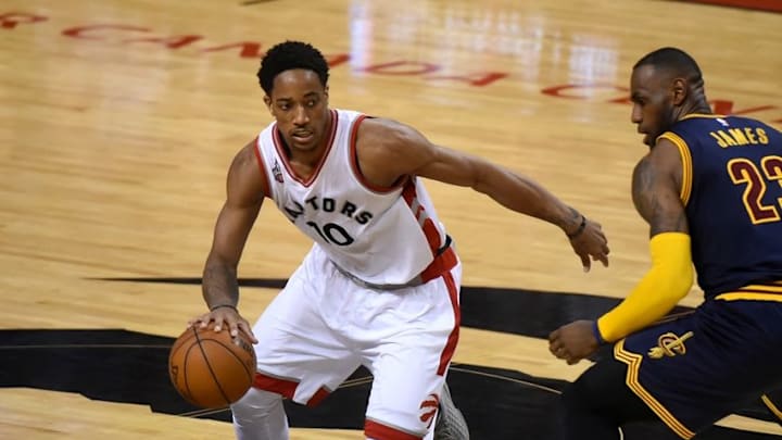 May 21, 2016; Toronto, Ontario, CAN; Toronto Raptors guard DeMar DeRozan (10) dribbles the ball past Cleveland Cavaliers forward LeBron James (23) in game three of the Eastern conference finals of the NBA Playoffs at Air Canada Centre. Mandatory Credit: Dan Hamilton-USA TODAY Sports