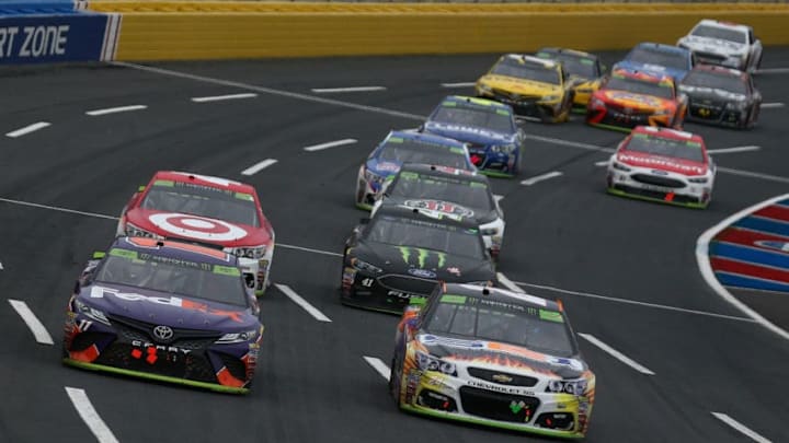 CHARLOTTE, NC - OCTOBER 08: Denny Hamlin, driver of the #11 FedEx Office Toyota, and Chase Elliott, driver of the #24 SunEnergy1 Chevrolet, lead a pack of cars during the Monster Energy NASCAR Cup Series Bank of America 500 at Charlotte Motor Speedway on October 8, 2017 in Charlotte, North Carolina. (Photo by Sarah Crabill/Getty Images)