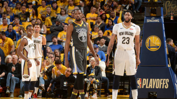 OAKLAND, CA - MAY 1: Kevin Durant #35 of the Golden State Warriors and Anthony Davis #23 of the New Orleans Pelicans look on in Game Two of the Western Conference Semifinals during the 2018 NBA Playoffs on May 1, 2018 at ORACLE Arena in Oakland, California. NOTE TO USER: User expressly acknowledges and agrees that, by downloading and/or using this photograph, user is consenting to the terms and conditions of Getty Images License Agreement. Mandatory Copyright Notice: Copyright 2018 NBAE (Photo by Noah Graham/NBAE via Getty Images)