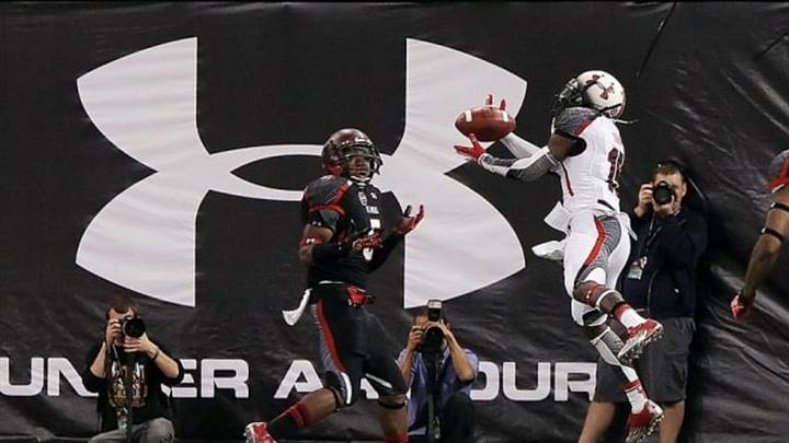 January 5, 2012; St. Petersburg, FL, USA; White team wide receiver MArvin Braxy (15) catches the ball for a touchdown as Black team cornerback Joshua Holsey (5) defends during the first half of the Under Armour All-America high school game at Tropicana Field. Mandatory Credit: Kim Klement-USA TODAY Sports