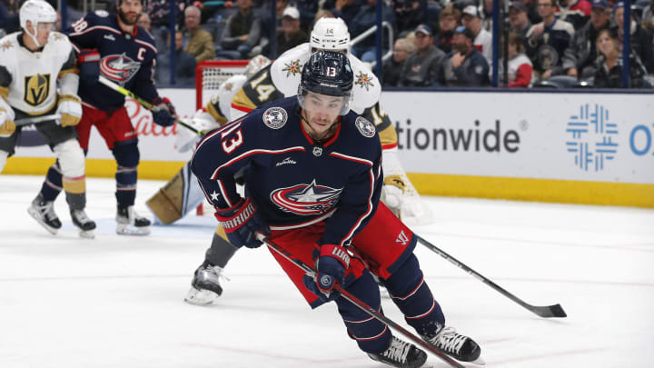 Nov 28, 2022; Columbus, Ohio, USA; Columbus Blue Jackets left wing Johnny Gaudreau (13) carries the puck away from Vegas Golden Knights defenseman Nicolas Hague (14) during the third period at Nationwide Arena. Mandatory Credit: Russell LaBounty-USA TODAY Sports