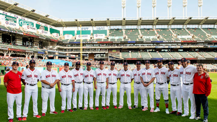 CLEVELAND, OH - JULY 09: Video Coordinator JT Watkins, first base coach Tom Goodwin, bullpen coach Craig Bjornson, pitching coach Dana LeVangie, third base coach Carlos Febles, bullpen catcher Mani Martinez, bench coach Ron Roenicke, coach Ramon Vazquez, manager Alex Cora, assistant hitting coach Andy Barkett, hitting coach Tim Hyers, Xander Bogaerts #2, Mookie Betts #50, J.D. Martinez #28, and video coordinator Billy Broadbent of the Boston Red Sox pose for a group photograph before the 2019 MLB All-Star Game at Progressive Field on July 9, 2019 in Cleveland, Ohio. (Photo by Billie Weiss/Boston Red Sox/Getty Images)