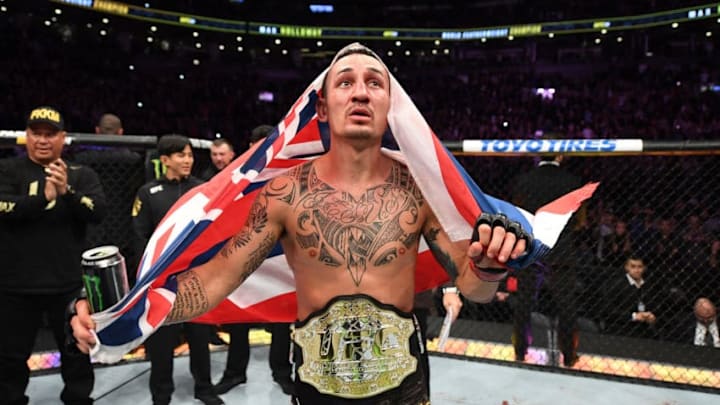 TORONTO, CANADA - DECEMBER 08: Max Holloway celebrates his victory over Brian Ortega in their UFC featherweight championship fight during the UFC 231 event at Scotiabank Arena on December 8, 2018 in Toronto, Canada. (Photo by Josh Hedges/Zuffa LLC/Zuffa LLC via Getty Images)