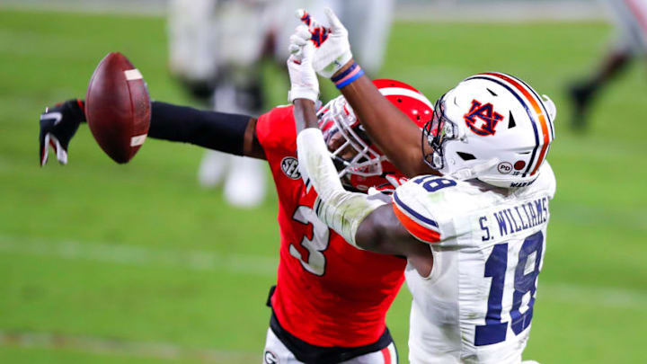 ATHENS, GA - OCTOBER 03: Tyson Campbell #3 of the Georgia Bulldogs breaks up a pass intended for Seth Williams #18 of the Auburn Tigers during the second half of a game at Sanford Stadium on October 3, 2020 in Athens, Georgia. (Photo by Todd Kirkland/Getty Images)