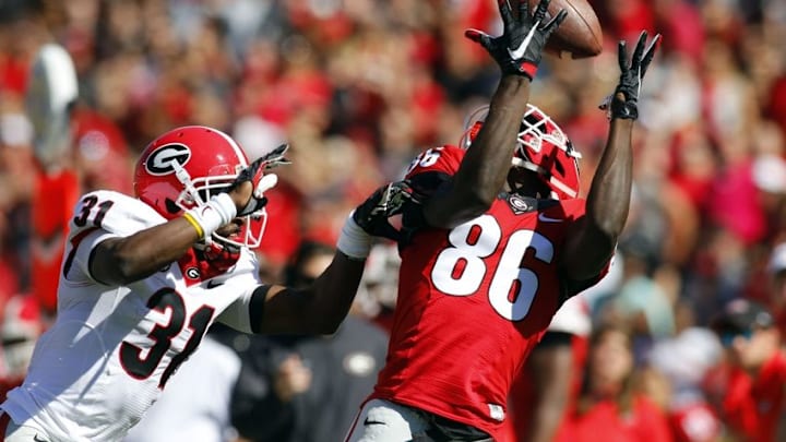 Apr 16, 2016; Athens, GA, USA; Georgia Bulldogs wide receiver Riley Ridley (86) catches a pass over cornerback Shattle Fenteng (31) during the first half of the spring game at Sanford Stadium. Mandatory Credit: Brett Davis-USA TODAY Sports