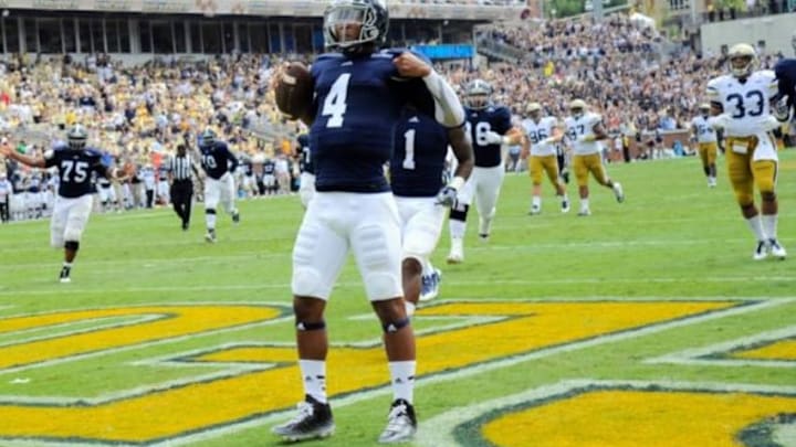 Sep 13, 2014; Atlanta, GA, USA; Georgia Southern Eagles quarterback Kevin Ellison (4) reacts after scoring a touchdown against the Georgia Tech Yellow Jackets during the second half at Bobby Dodd Stadium. Georgia Tech defeated Georgia Southern 42-38. Mandatory Credit: Dale Zanine-USA TODAY Sports