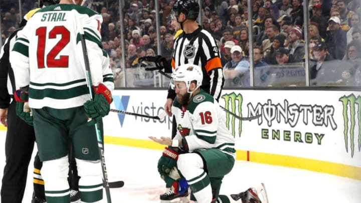 BOSTON, MA - NOVEMBER 23: Minnesota Wild left wing Jason Zucker (16) checks for blood after taking a high stick during a game between the Boston Bruins and the Minnesota Wild on November 23, 2019, at TD Garden in Boston, Massachusetts. (Photo by Fred Kfoury III/Icon Sportswire via Getty Images)