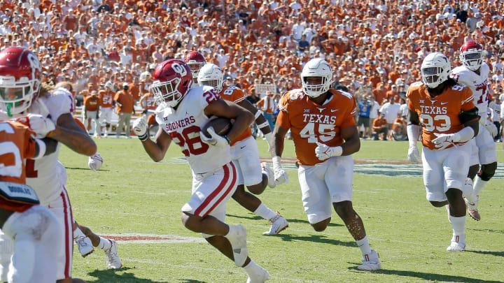 Oklahoma’s Kennedy Brooks (26) runs for the game-winning touchdown the Red River Showdown college football game between the University of Oklahoma Sooners (OU) and the University of Texas (UT) Longhorns at the Cotton Bowl in Dallas, Saturday, Oct. 9, 2021. Oklahoma won 55-48.Ou Vs Texas