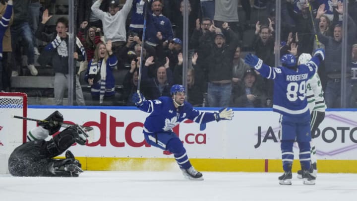 Oct 20, 2022; Toronto, Ontario, CAN; Toronto Maple Leafs left wing Nicholas Robertson (89) scores the winning goal and celebrates with Toronto Maple Leafs center Auston Matthews (34) against the Dallas Stars during the overtime period at Scotiabank Arena. Mandatory Credit: Nick Turchiaro-USA TODAY Sports