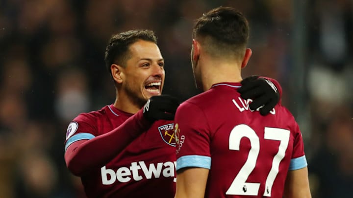 LONDON, ENGLAND - DECEMBER 04: Lucas Perez of West Ham United celebrates with teammate Javier Hernandez after scoring his team's first goal during the Premier League match between West Ham United and Cardiff City at London Stadium on December 4, 2018 in London, United Kingdom. (Photo by Dan Istitene/Getty Images)