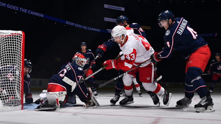 COLUMBUS, OH - OCTOBER 30: Scott Harrington #4 of the Columbus Blue Jackets defends as Sergei Bobrovsky #72 stops a shot from Darren Helm #43 of the Detroit Red Wings during the second period on October 30, 2018 at Nationwide Arena in Columbus, Ohio. (Photo by Jamie Sabau/NHLI via Getty Images)