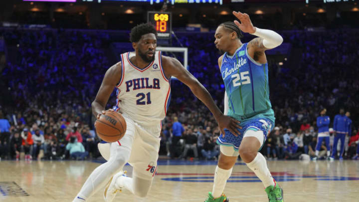 Jan 12, 2022; Philadelphia, Pennsylvania, USA; Philadelphia 76ers center Joel Embiid (21) drives to the basket against Charlotte Hornets forward P.J. Washington (25) in the second half at the Wells Fargo Center. Mandatory Credit: Mitchell Leff-USA TODAY Sports