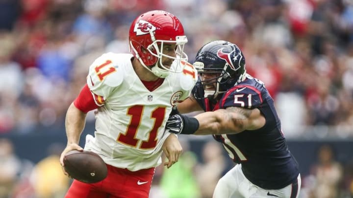 Sep 18, 2016; Houston, TX, USA; Kansas City Chiefs quarterback Alex Smith (11) scrambles out of the pocket as Houston Texans outside linebacker John Simon (51) chases during the fourth quarter at NRG Stadium. The Texans won 19-12. Mandatory Credit: Troy Taormina-USA TODAY Sports