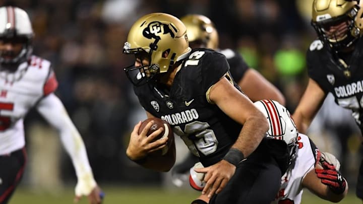 Nov 26, 2016; Boulder, CO, USA; Colorado Buffaloes quarterback Sefo Liufau (13) scrambles with ball in the second half against the Utah Utes at Folsom Field. The Buffaloes defeated the Utes 27-22. Mandatory Credit: Ron Chenoy-USA TODAY Sports