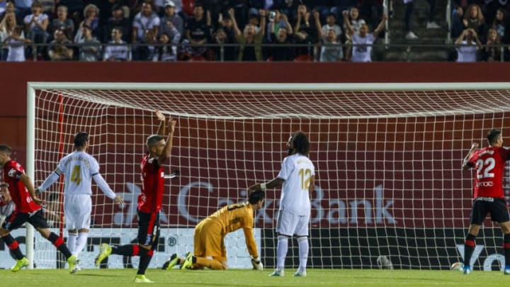 MALLORCA, SPAIN - OCTOBER 19: Sergio Ramos of Real Madrid, Thibaut Courtois of Real Madrid and Marcelo Vieira of Real Madrid looks dejected. Lago Junior of RCD Mallorca celebrate his goal with team mates during the Liga match between RCD Mallorca and Real Madrid CF at Iberostar Estadi on October 19, 2019 in Mallorca, Spain. (Photo by TF-Images/Getty Images)