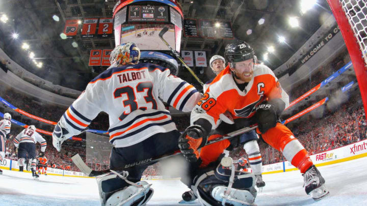 PHILADELPHIA, PA - OCTOBER 21: Claude Giroux #28 of the Philadelphia Flyers is pushed into goaltender Cam Talbot #33 of the Edmonton Oilers by Kailer Yamamoto #56 on October 21, 2017 at the Wells Fargo Center in Philadelphia, Pennsylvania. The Flyers went on to defeat the Oilers 2-1. (Photo by Len Redkoles/NHLI via Getty Images)