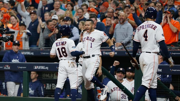 HOUSTON, TX - OCTOBER 17: Tony Kemp #18 of the Houston Astros celebrates with Carlos Correa #1 after hitting a solo home run in the fourth inning against the Boston Red Sox during Game Four of the American League Championship Series at Minute Maid Park on October 17, 2018 in Houston, Texas. (Photo by Bob Levey/Getty Images)