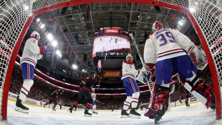 RALEIGH, NC - DECEMBER 31: Sebastian Aho #20 of the Carolina Hurricanes (not pictured) bats a puck out of the air and scores past goaltender Charlie Lindgren #39 of the Montreal Canadiens during an NHL game on December 31, 2019 at PNC Arena in Raleigh, North Carolina. (Photo by Gregg Forwerck/NHLI via Getty Images)