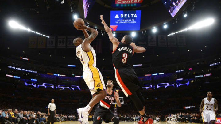 LOS ANGELES, CA - NOVEMBER 22: Kobe Bryant #24 of the Los Angeles Lakers shoots as C.J. McCollum #3 of the Portland Trail Blazers defends during the second half of the basketball game at Staples Center November 22, 2015 in Los Angeles, California. NOTE TO USER: User expressly acknowledges and agrees that, by downloading and or using the photograph, User is consenting to the terms and conditions of the Getty Images License Agreement. (Photo by Kevork Djansezian/Getty Images)