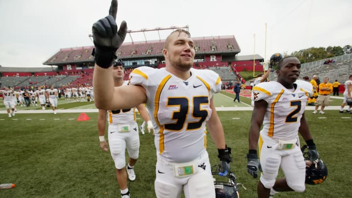 PISCATAWAY, NJ – OCTOBER 27: Fullback Owen Schmitt #35 of the West Virginia Mountaineers celebrates after defeating the Rutgers University Scarlet Knights on October 27, 2007 at Rutgers Stadium in Piscataway, New Jersey. (Photo by Ned Dishman/Getty Images)