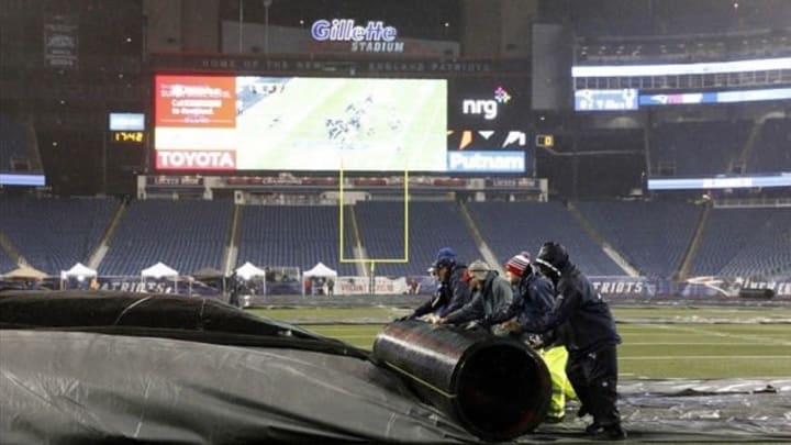 Jan 11, 2014; Foxborough, MA, USA; Grounds crew prepare the field before the start of the 2013 AFC divisional playoff football game against the New England Patriots and Indianapolis Colts at Gillette Stadium. Mandatory Credit: David Butler II-USA TODAY Sports