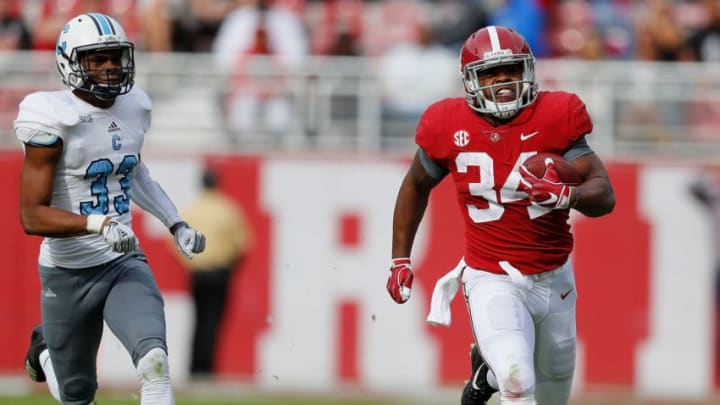 TUSCALOOSA, AL - NOVEMBER 17: Damien Harris #34 of the Alabama Crimson Tide rushes away from Ronald Peterkin #33 of the Citadel Bulldogs at Bryant-Denny Stadium on November 17, 2018 in Tuscaloosa, Alabama. (Photo by Kevin C. Cox/Getty Images)