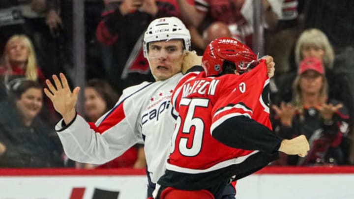 RALEIGH, NC – SEPTEMBER 29: Washington Capitals right wing Garnet Hathaway (21) and Carolina Hurricanes defenseman Roland McKeown (55) fight during an NHL preseason game between the Washington Capitals and the Carolina Hurricanes on September 29, 2019, at the PNC Arena in Raleigh, NC. (Photo by Greg Thompson/Icon Sportswire via Getty Images)