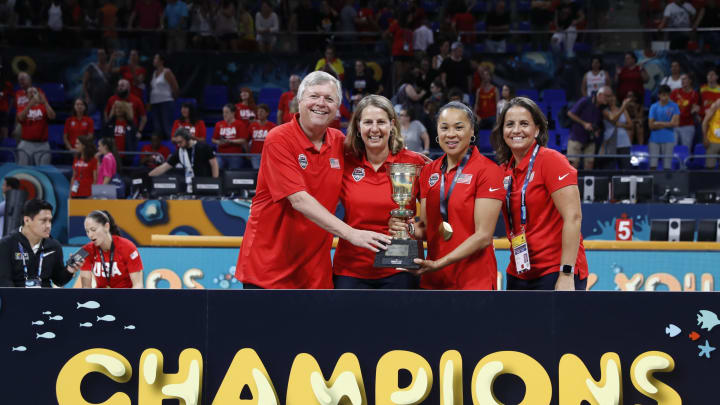 TENERIFE, SPAIN – SEPTEMBER 30: Assistant Coaches Dan Hughes Cheryl Reeve Head Coach Dawn Staley and Assistant Coach Jennifer Rizzotti of the USA National Team pose with the championship trophy after defeating the Australia team during the Gold Medal Game of the FIBA Women’s Basketball World Cup at Pabellon de Deportes de Tenerife Santiago Martin on September 30, 2018 in San Cristobal de La Laguna, Spain. NOTE TO USER: User expressly acknowledges and agrees that, by downloading and or using this photograph, User is consenting to the terms and conditions of the Getty Images License Agreement. Mandatory Copyright Notice: Copyright 2018 NBAE. (Photo by Catherine Steenkeste/NBAE via Getty Images)