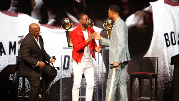 Former Miami Heat player Dwyane Wade greets former Miami Heat player Chris Bosh during the Miami Heat Dwyane Wade L3GACY Celebration (Photo by Michael Reaves/Getty Images)