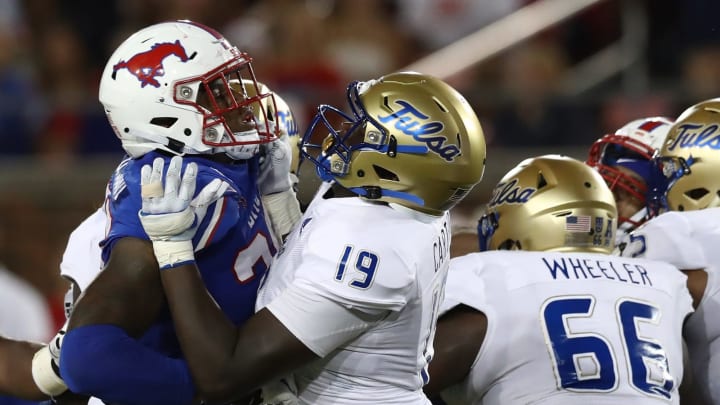 DALLAS, TEXAS – OCTOBER 05: Delontae Scott #35 of the Southern Methodist Mustangs and Denzel Carter #19 of the Tulsa Golden Hurricane at Gerald J. Ford Stadium on October 05, 2019 in Dallas, Texas. (Photo by Ronald Martinez/Getty Images)