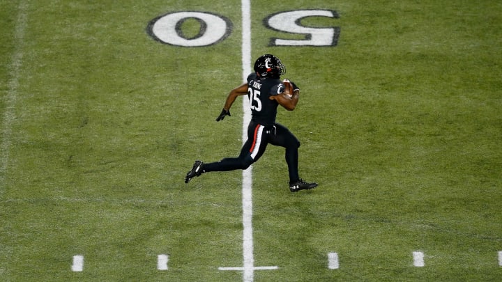 Cincinnati Bearcats running back Cameron Young (25) breaks away for 75-yard touchdown in the fourth quarter of the NCAA American Athletic Conference football game between the Cincinnati Bearcats and the East Carolina Pirates at Nippert Stadium in Cincinnati on Friday, Nov. 13, 2020. The Bearcats extended a school record home winning streak to 19 with a 55-17 victory on Senior Night.