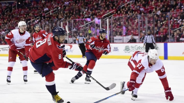 WASHINGTON, DC - NOVEMBER 23: Alex Ovechkin #8 of the Washington Capitals shoots and scores a goal in the third period against the Detroit Red Wings at Capital One Arena on November 23, 2018 in Washington, DC. (Photo by Patrick McDermott/NHLI via Getty Images)