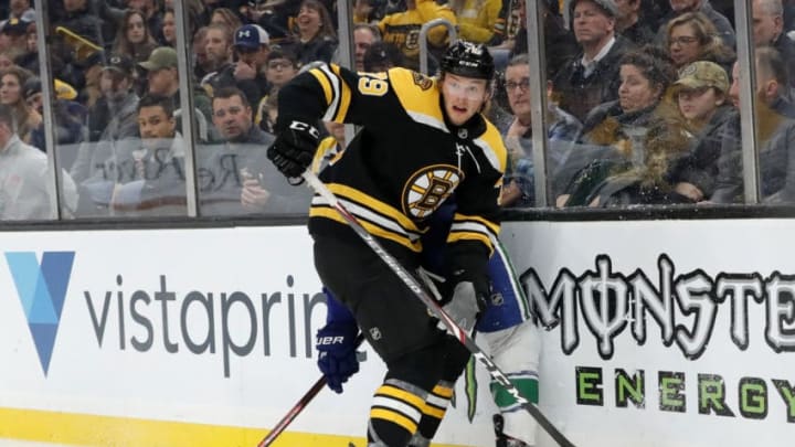 BOSTON, MA - FEBRUARY 04: Boston Bruins left defenseman Jeremy Lauzon (79) looks to clear the puck during a game between the Boston Bruins and the Vancouver Canucks on February 4, 2020, at TD Garden in Boston, Massachusetts. (Photo by Fred Kfoury III/Icon Sportswire via Getty Images)