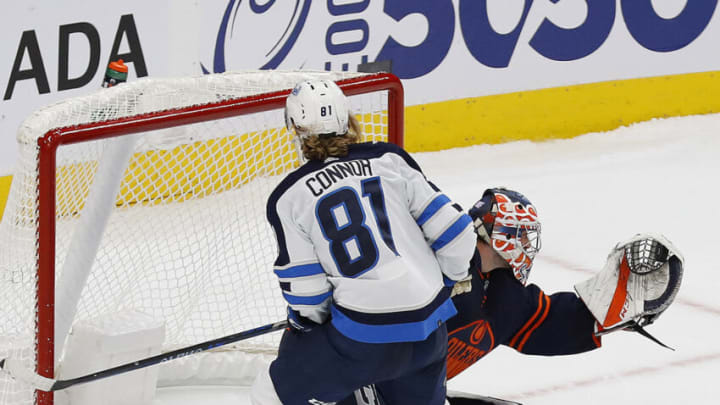 Edmonton Oilers goaltender Stuart Skinner (74) makes a save on Winnipeg Jets forward Kyle Connor (81) Mandatory Credit: Perry Nelson-USA TODAY Sports