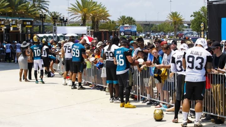 Jun 14, 2016; Jacksonville, FL, USA; Jacksonville Jaguars players sign autographs after minicamp workouts at Florida Blue Health and Wellness Practice Fields. Mandatory Credit: Logan Bowles-USA TODAY Sports