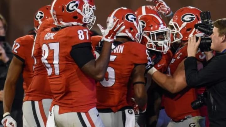 Nov 21, 2015; Athens, GA, USA; Georgia Bulldogs players react with running back Sony Michel (1) (second from right) after he scored the game winning touchdown against the Georgia Southern Eagles during overtime at Sanford Stadium. Georgie defeated Georgia Southern 23-17 in overtime. Mandatory Credit: Dale Zanine-USA TODAY Sports