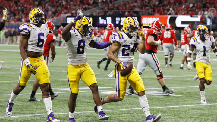 ATLANTA, GEORGIA – DECEMBER 07: Derek Stingley Jr. #24 of the LSU Tigers celebrates with teammates after intercepting a pass in the third quarter against the Georgia Bulldogs during the SEC Championship game at Mercedes-Benz Stadium on December 07, 2019 in Atlanta, Georgia. (Photo by Kevin C. Cox/Getty Images)