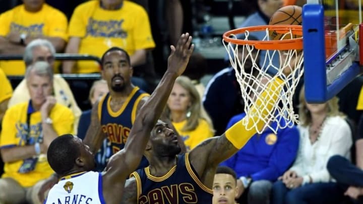 Jun 2, 2016; Oakland, CA, USA; Cleveland Cavaliers forward LeBron James (23) shoots the ball against Golden State Warriors forward Harrison Barnes (40) in game one of the NBA Finals at Oracle Arena. Mandatory Credit: Bob Donnan-USA TODAY Sports